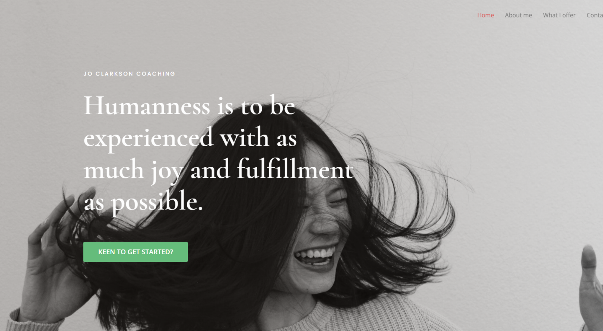 Screen shot of the Home Page of the new website built by Neighbourhood Online Lucy Granville for Life Coach Jo Clarkson, shows a happy smiling woman turning with her hand in the air and her long dark hair swishing, with some words over the image.
